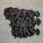 Paquets de cheveux crus boucles en vague