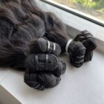 Paquets de cheveux crus boucles en vague